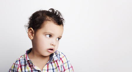 Portrait of a handsome boy on a white backgroundの写真素材