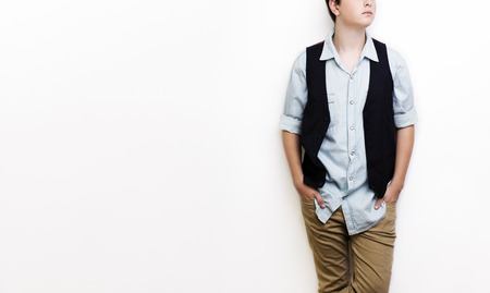 Stylish handsome young man posing. Studio shot on white background