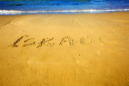 Inscription Israel on golden sand beach of Eilat, Israelの写真素材