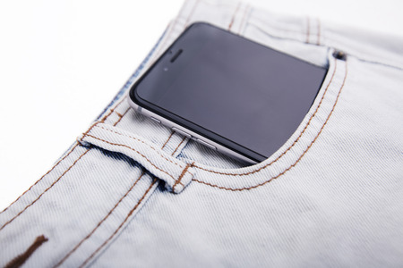 Denim Jeans Background With phone and Seam of Jeans Fashion Design. Stitched Texture Denim Jeans Background of Fashion Jean Designの写真素材