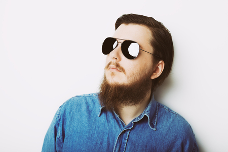 Studio portrait of caucasian young man on white backgroundの写真素材