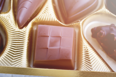 A collection of mixed chocolates against isolated on a white background