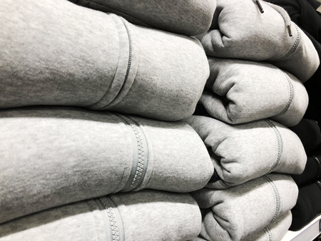Sale of warm winter clothes on the counter of the store