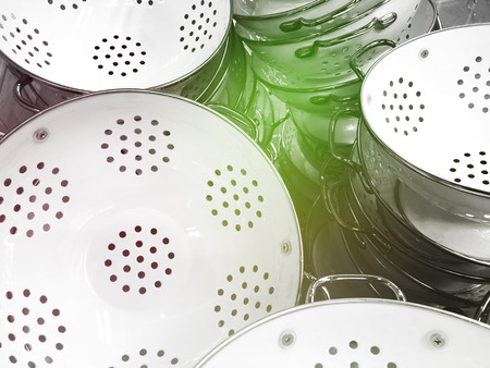 Stainless steel kitchen sieves together. Image of strainer. Kitchenware shopの写真素材