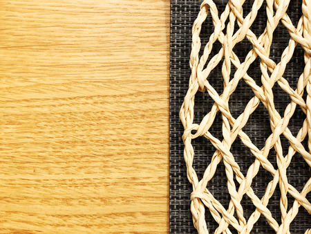 Wickerwork on a wooden background. Close viewの写真素材