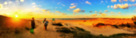 Blurred people having sunset beach in summer vacation. Blurred background.の写真素材