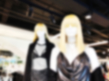 Blurred mannequins in a clothing shop in shopping mall. Abstract blurred background