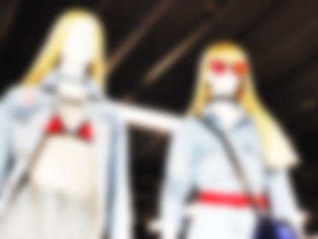 Blurred mannequins in a clothing shop in shopping mall. Abstract blurred background