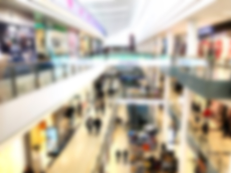 Shopping mall blur background with bokeh. Blurred hall of shopping mall as background.の写真素材