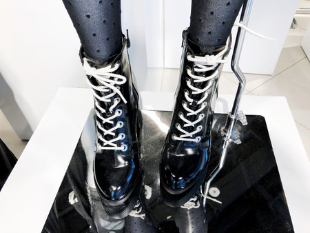 Women's fashion boots in the store on the shelf close-up.の写真素材