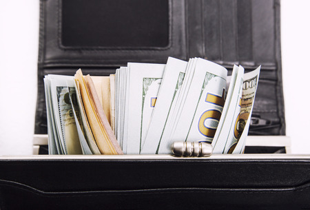 A pile of  US banknotes with president portraits. Cash of  dollar bills, dollar background image.の写真素材