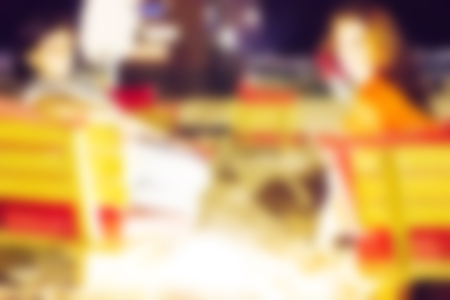 Abstract blurred background. Vacation and fun on the beach. Blurred peopleの写真素材