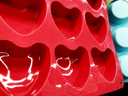 Closeup photo of multi-colored shapes for batter for baking cupcakesの写真素材