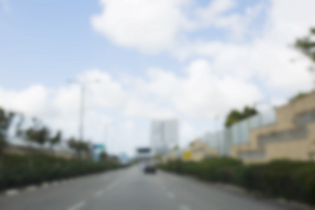 Abstract blurred background. Blurred road with car running.の写真素材