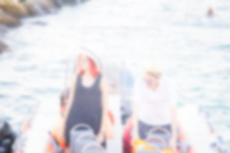 Abstract blurred background of people. Beautiful couple of lovers sailing on a boat.の写真素材
