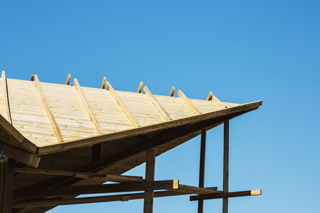 Modern design pergola arbor made wood with clear blue summer sky.