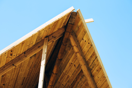 Modern design pergola arbor made wood with clear blue summer sky.