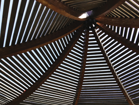 Modern design pergola arbor made wood with clear blue summer sky.の写真素材