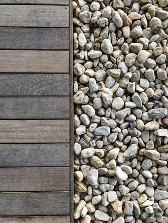 Wooden floor and stones close up. Top view.の写真素材