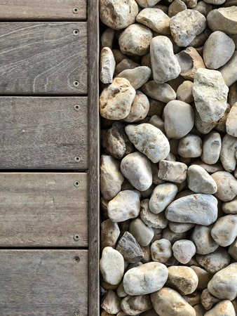 Wooden floor and stones close up. Top view.の写真素材