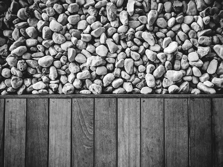 Wooden floor and stones close up. Top view.の写真素材