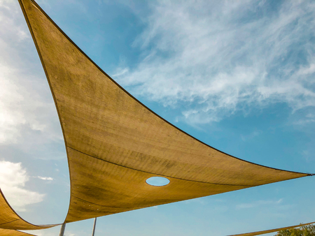 Awning in the midday sun against the skyの写真素材
