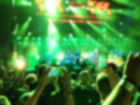 Blurred abstract background. Bokeh lighting in concert with audienceの写真素材