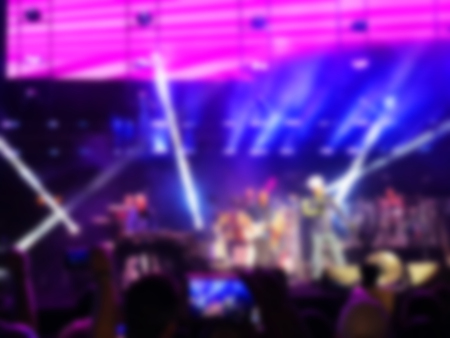 Blurred abstract background. Bokeh lighting in concert with audienceの写真素材