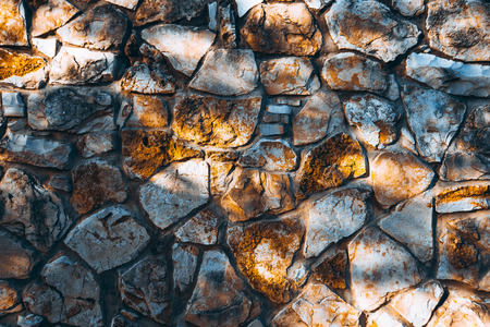 Close up of natural stone wall. Stone wall texture.