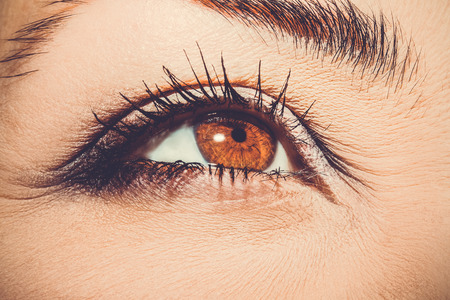 A beautiful insightful look woman's eye. Close up shot.の写真素材