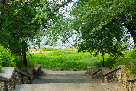 The bank of the river, descent to the water staircase. Spring time.の写真素材