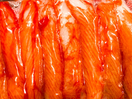 Crab meat in the package in the store. Background closeup.