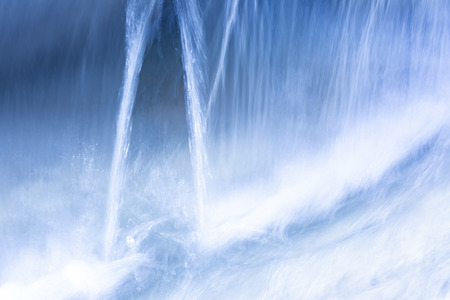 Abstract motion blur effect. Close up of beautiful city fountain.の写真素材