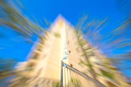 Abstract motion blur effect. City on a sunny day.