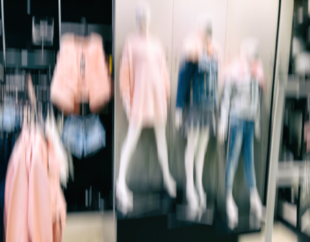Abstract motion blur effect. Shopping mall as background, bokeh.