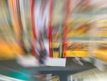 Abstract motion blur effect. Shopping mall as background, bokeh.