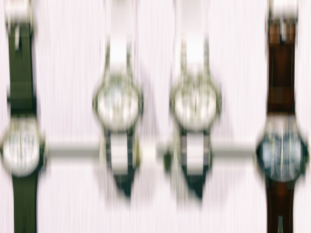 Watch clocks exposed in a store. Abstract motion blur effect