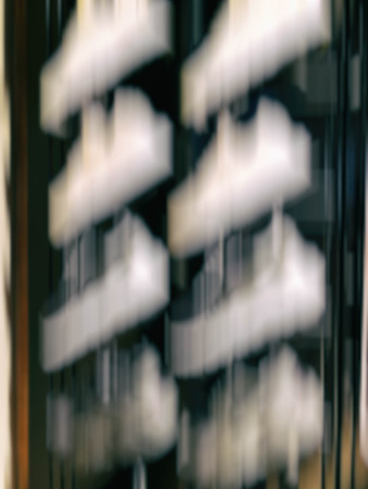 Abstract motion blur effect. Shopping mall as background, bokeh.