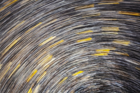 Abstract motion blur effect. Asphalt texture on road.の写真素材