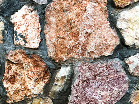 Close up of natural stone wall. Stone wall texture.