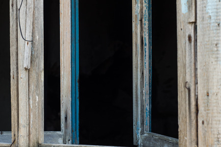 The old window of an old abandoned house.