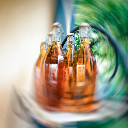 Motion effect Georgian natural white wine bottled in glass bottles. Close up shot.の写真素材