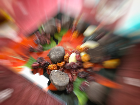 Motion effect  Dried fruits and chocolates on a plate. Close up shot.の写真素材