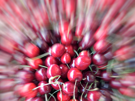 Motion effect  ripe garden red cherry. Fruit, vitamins.  Summer healthy food.