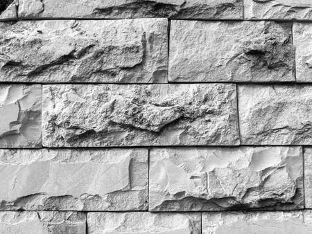 Closeup shot of modern stone tiled wall background in black and white. Horizontal stone tile pattern.の写真素材