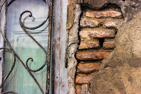 Piece of a ruined brick old wall background