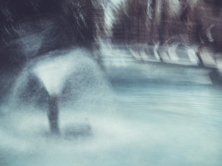 Abstract motion blur effect background. Fountains in city park.の写真素材