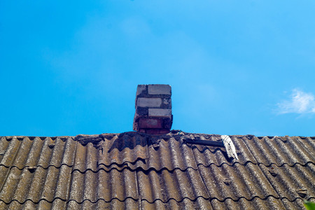 Pipe on the roof. Chimney. Country house. House with a chimneyの写真素材