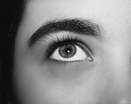 A beautiful insightful look girl's eye. Close up shotの写真素材