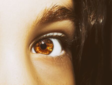 A beautiful insightful look girl's eye. Close up shotの写真素材